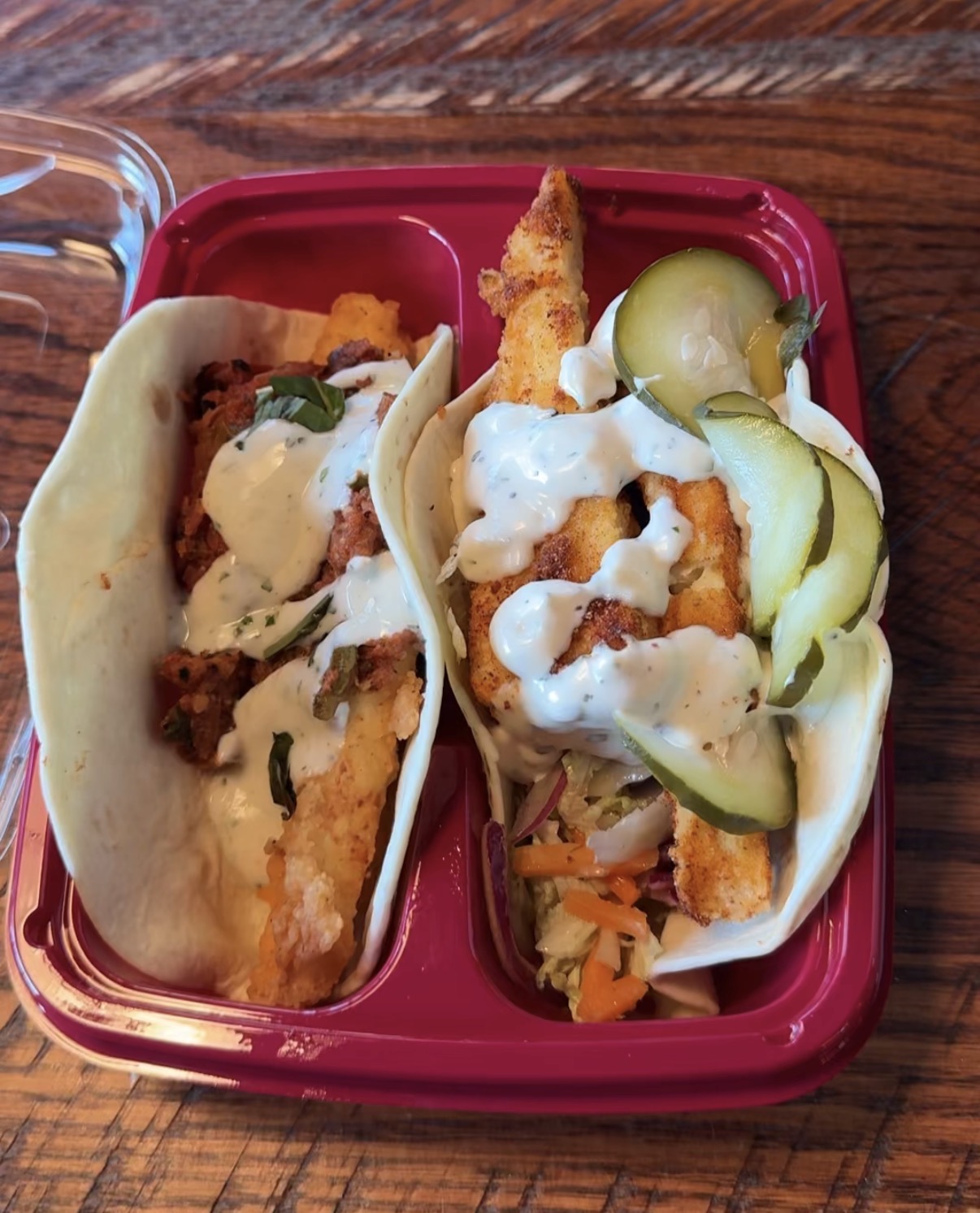 Two vegetarian tacos with creamy herb sauce and pickles from Velvet Taco in Dunwoody, Georgia
